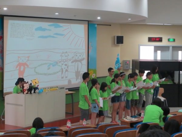 Children presenting a story exchange program